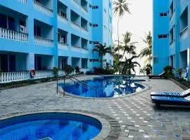 Cowrie Shell Beach Apartments Official