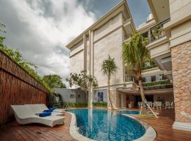 Alron Hotel Kuta Powered by Archipelago，位于库塔拉雅库塔的酒店