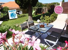 Bas de villa jardin plein sud proche mer clim-Wifi，位于滨海圣芒德里耶的酒店