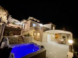 Villa Fjera with a sea view, hot tubs, terrace, BBQ，位于普契什查的酒店