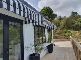 Tiny house with greenhouse dining