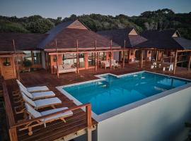 Aloha 10 I 4Bed Villa with Stunning Sea View Pool，位于Ponta Mamoli的酒店