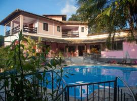 Pousada Casa Rosa，位于戈亚斯州上帕莱索的带泳池的酒店
