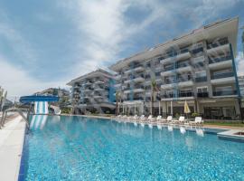 Calypso Residence Luxurious Beachside Apartment in Alanya D6，位于阿拉尼亚的家庭/亲子酒店