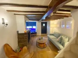 1750's cottage with open fire and beams