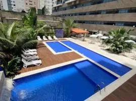 Flat Capitania Varam Guarujá com varanda gourmet