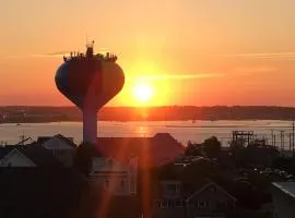 Direct Oceanfront on the boardwalk In OCMD, At Boardwalk One we have a Private Balcony, Kitchen, a pool and access to a state-of-the-art gym, Room 402