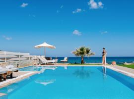 Hersonissos Beach Villa - Your Seafront Retreat by etouri，位于赫索尼索斯的酒店