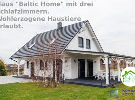 Dom Wakacyjny Baltic Home & Dom Baltic Home Garden Inn，位于Zastań的酒店