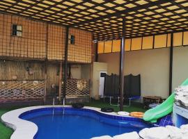 chalet IN，位于Muţī的酒店
