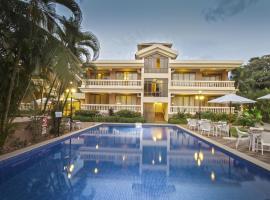 De Mandarin Beach Resort Suites & Villas, Candolim，位于坎多林的度假村