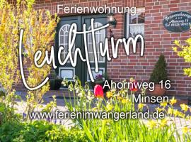 Ferien im Wangerland Ferienwohnung LEUCHTTURM Minsen Schillig Hund Pool Sauna，位于Norderaltendeich的酒店