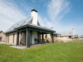 Modern design lodge on the water located on a holiday park in a national park