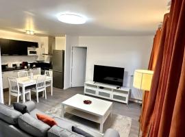 Appartement Cozy - Quartier résidentiel，位于默伦的酒店