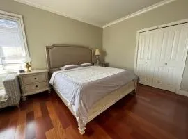 A cozy bedroom with a private washroom close to YVR Richmond