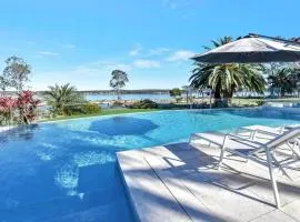 Lake Palm Resort Luxury Retreat absolute Waterfront on 3 acres at Lake Macquarie.
