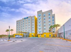 墨西卡利都市快捷酒店，位于墨西卡利鲁道夫·桑切斯·塔沃阿达将军国际机场 - MXL附近的酒店