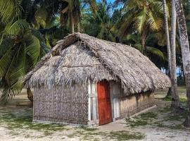 Cabañas tradicionales en isla Aroma，位于Warsobtugua的海滩短租房