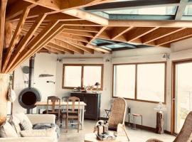 Superbe maison design en bois vue Mer，位于欧村的酒店