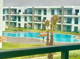 Appartement Cozy avec piscine，位于西迪拉哈尔的酒店