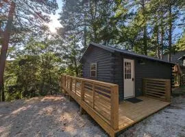 Log Cabin #2 with hot tub deck and sunset view at Loblolly Pines