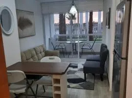 Acogedor Departamento Central con Piscina, Estacionamiento Privado y Más