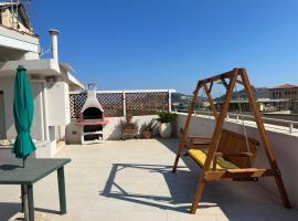 Nuovo attico con terrazza 5 minuti dal mare，位于卡利亚里Binaghi Hospital附近的酒店