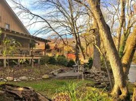 Water's Edge ~ Covered Porch w/ Deep Creek as your Backyard Haven