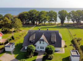 Reethus am Strand - Haushälfte 2 mit Kamin, Sauna，位于洛布的酒店