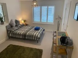 Very large double room with corner sofa and Sky TV