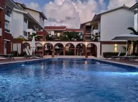 SEVEN SHADES OF CORAL VILLAGE - suites & pool in a residence close to the beach