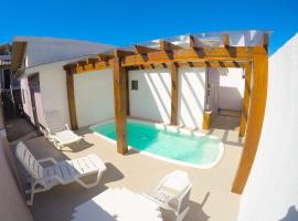 Residencial Viva Torres - Casas com 2 Dorms, Ar e Piscina Aquecida na Praia da Cal，位于托雷斯的酒店