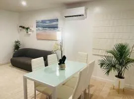 Vacation House 2-Bedroom 1 Bathroom in Beach Town with Full size Kitchen and free onsite parking and laundry - Great for solo, couple, family and business travelers