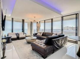 Oceanfront View Wrap Around Balcony Luxury Corner Unit Ebb Tide 401，位于新士麦那海滩的酒店