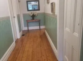 Large bedroom with twin beds and private bathroom