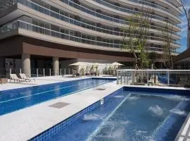 Studio moderno em condomínio de luxo pé na areia