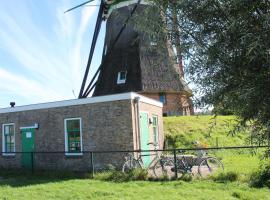 slapen aan de voet van de molen，位于Ovezande的带停车场的酒店