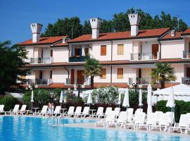 Apartment in a residence with pool in Rosolina，位于罗索利纳马雷的酒店