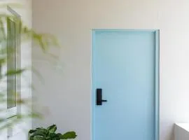The Elements l Water l 4 Stunning Apartments each with Private Outdoor Dining l Walk to the Beach l Pet Family and Event Friendly l Wifi l Netflix l Outdoor Shower l Communal BBQ Pavilion and Lawn Area l