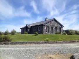 Detached cottage overlooking lake in Connemara