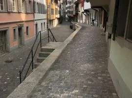 Bedroom cum office with shared shower in Zug's Old Town