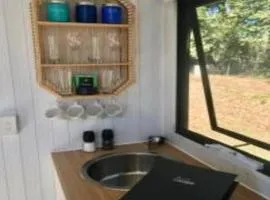 White Jacaranda Tiny House by Tiny Away