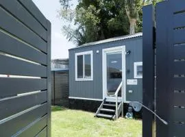 Sweet beautiful TINY HOME with pool and 2 minute drive to the beach