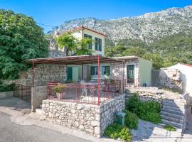 Apartments with a parking space Igrane, Makarska - 6796，位于伊格拉恩的酒店