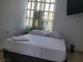Apartamento cerca a la Basílica de Buga，位于布加的酒店