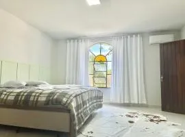 Suíte na casa amarela