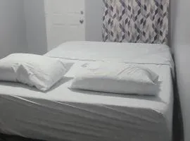 Room in a Beach House with Queen bed in a landlord hosted three bedroom apartment