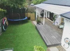 Coastal 3 bedroom house with private oasis.