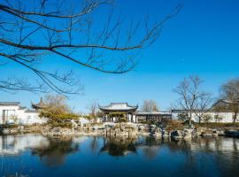 扬州芒稻田园度假酒店，位于扬州的酒店