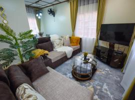 Entire 3-Bedroom Holiday Home in Kampala, Lovingly Furnished，位于坎帕拉的酒店